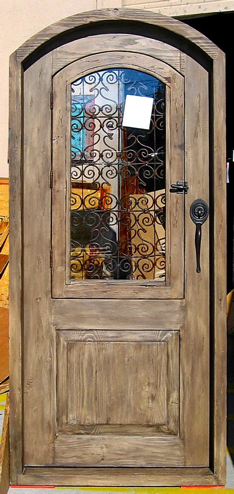 Grilled Exterior Door La Puerta Originals Arched Door With Iron