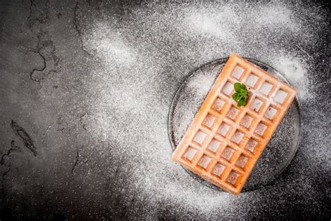 Premium Photo Belgian Waffles Sprinkled With Powdered Sugar