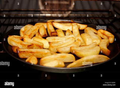 cooking oven chips in the oven Stock Photo: 78456677 - Alamy