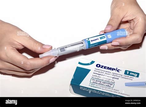 Female hands holding an insulin pen. Ozempic Insulin injection pen or ...