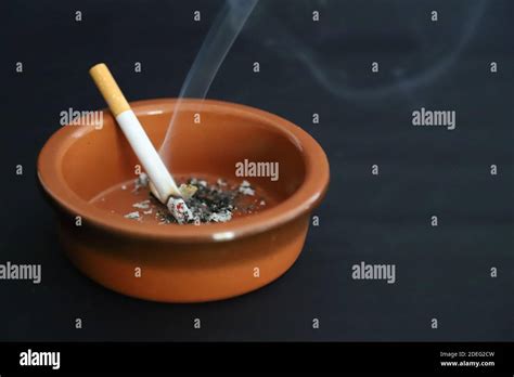 Cigarette In An Ashtray Stock Photo Alamy