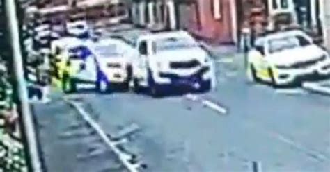 Moment Driver Rams Into Police Car Before Speeding Off Leaving Two