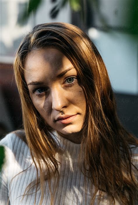 Portrait Of Young Adult Female Outdoors With Shadows And Face Obscure By Stocksy Contributor