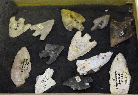 A Group Of Twelve Mainly British Neolithic Flint Arrowheads Some