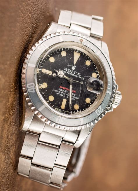 A Vintage Rolex Red Submariner Watch With An Actual History Of