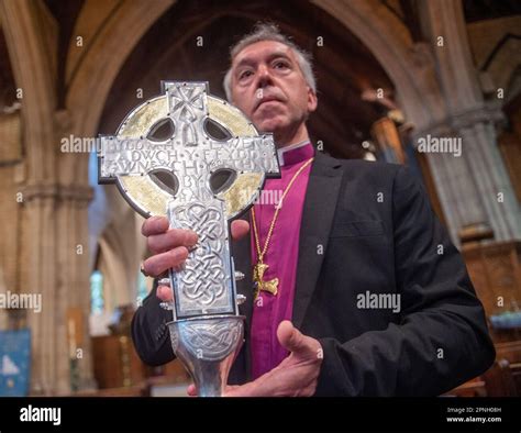 Archbishop Of Wales Andrew John With The Cross Of Wales Ahead Of A