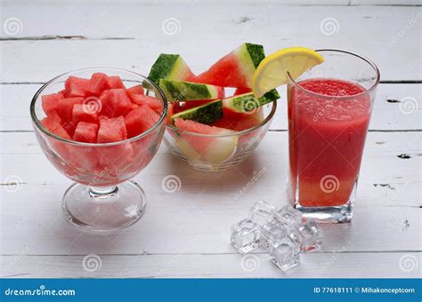 Slices Of Juicy Watermelon Into A Bowl Of Watermelon And A Glass Stock