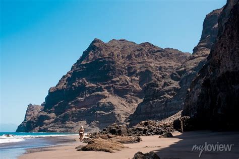 Nude Woman Walking In Scenic Gui Gui Beach In Gran Canaria Island