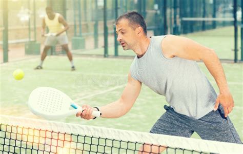 Male Players Playing Padel in a Padel Court Outdoor Behind Net Stock Image - Image of caucasian ...