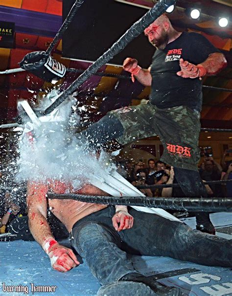 Nice Timed Photo Shot Of Nick Gage Driving The Boot Into The Light