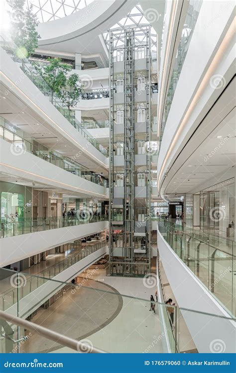 Glass Elevators In White Retail Interior Design Shopping Mall Luone