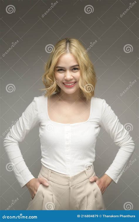 Portrait Of Young Blonde Woman Over White Background Studio Stock Image