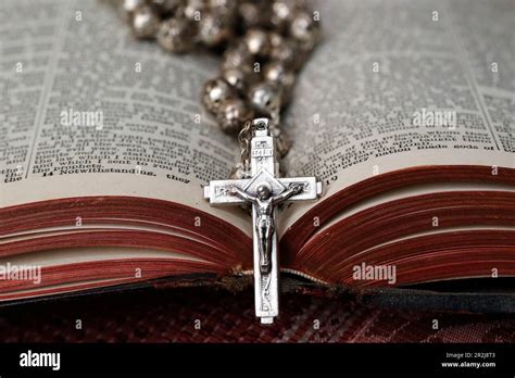 Vintage Rosary With Crucifix On An Open Bible Christian Religious