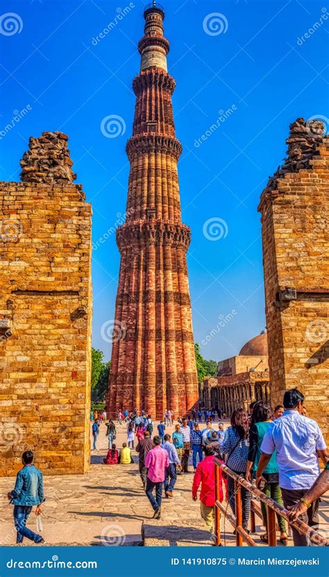 Qutb Minar Tower Seen Through The Ruined Quwwat Ul Islam Mosque At