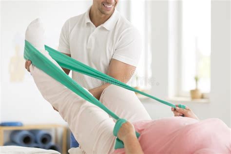 Physiotherapist Performing an Ortolani Maneuver during a Newborn Baby ...