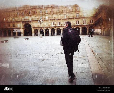 Man crosses Plaza mayor in Salamanca, Spain Stock Photo - Alamy