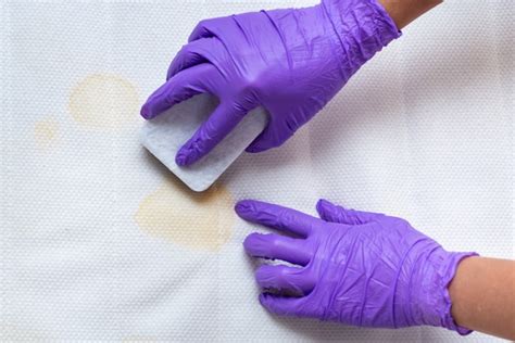 Premium Photo | Women hands clean a dirty mattress with stains