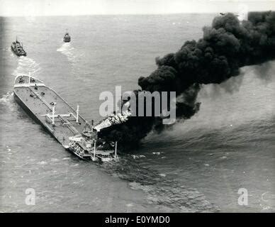 An Oil Tanker Is On Flames In The Harbour Of BP Refinery In Lingen