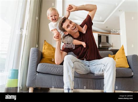 Father And Son Relationships Handsome Dad Carrying Baby Boy On His