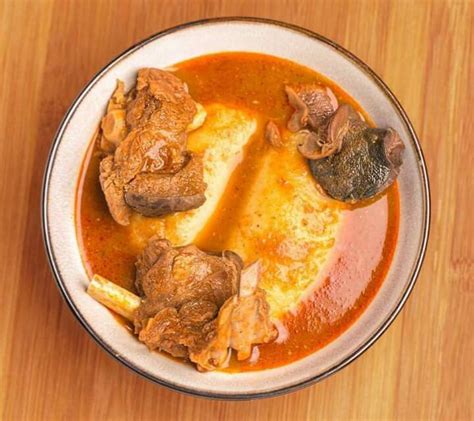 Fufu With Light Soup And Goat Meat Food African Cooking African Food