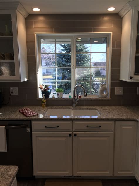 Full height backsplash. 4"x 12" subway tile. Cambria Quartz countertops ...