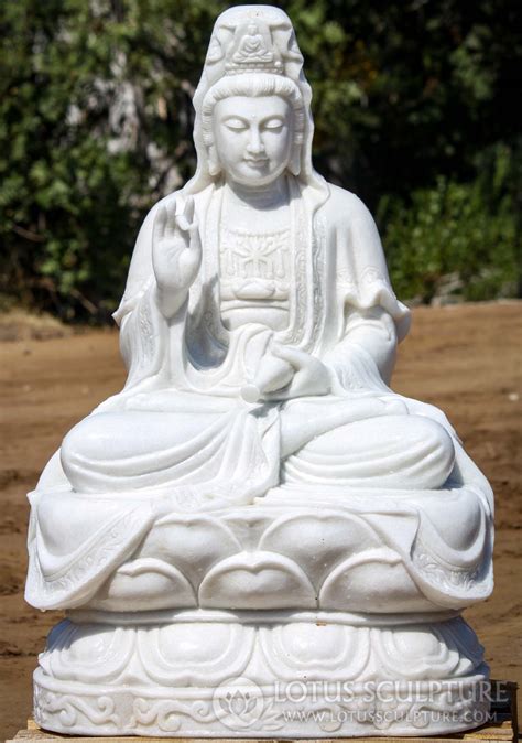 White Marble Kwan Yin Sculpture Seated On Lotus Base Holding Vase Of