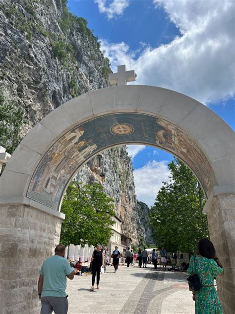 entrance to ostrog monastery in montenegro - one of the holiest places ...