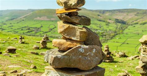 Stones Stacked On Grassland · Free Stock Photo