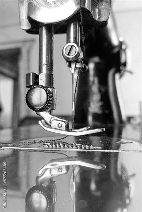 An Old Sewing Machine Stands On The Table At Home Ready To Work And Sew