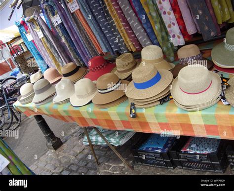 Straw Hats And Scarves On Market Stall Stock Photo Alamy