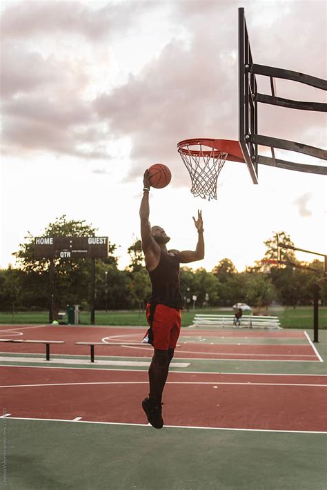 "An Attractive Young Black Man Playing Basketball O On A Sunny Day" by ...