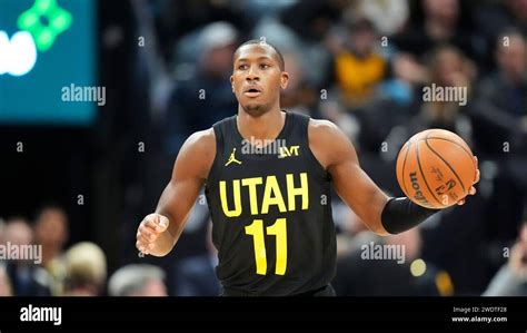 Utah Jazz Guard Kris Dunn Brings The Ball Up Court During The