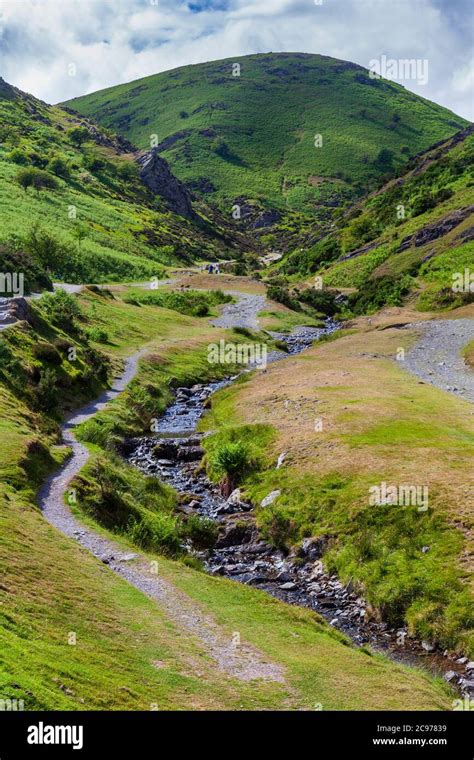 The Footpath Through Carding Mill Valley With Calf Ridge In The