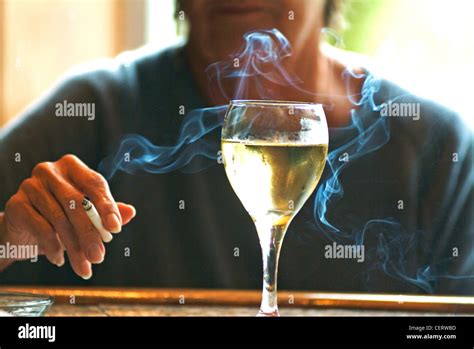 Woman smoking and drinking hi-res stock photography and images - Alamy