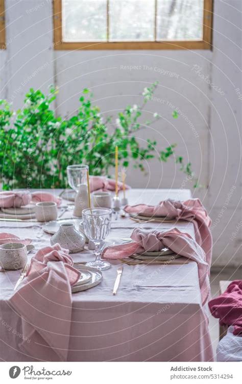 Banquet table with dishware and glasses - a Royalty Free Stock Photo from Photocase