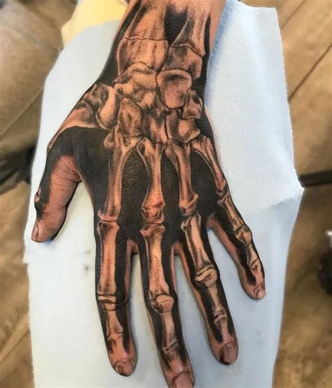 Skeleton Hand Tattoo Designs