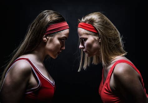 Premium Photo Two Female Boxers In Red Sportswear Standing Face To