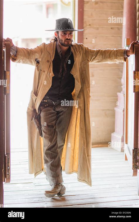 Cowboy standing in saloon doorway on wild west film set, Fort Bravo ...