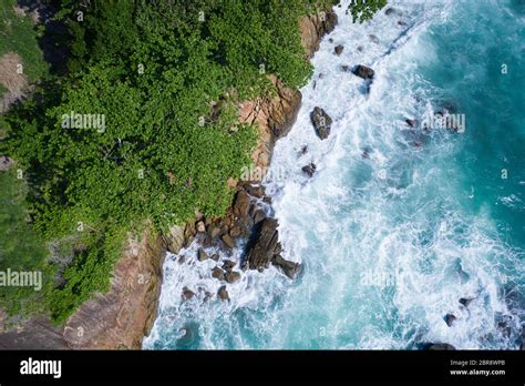 Aerial Drone Top View Of Ocean S Beautiful Waves Crashing On The Rocky