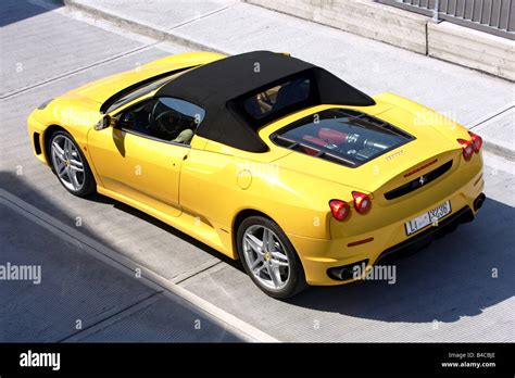 Car Ferrari F430 Spider Model Year 2005 Yellow Convertible Driving Standing Upholding