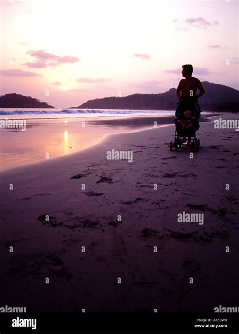 Sunset walk palolem beach india Stock Photo - Alamy