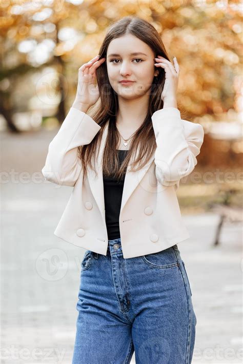 Vertical photo. Beautiful carefree young teenage girl in casual clothes ...