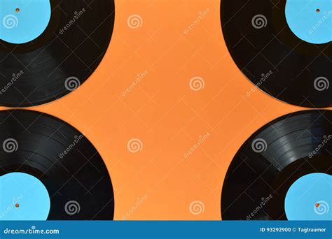 Four Quarters Of Black Vinyl Record On Orange Stock Photo Image Of