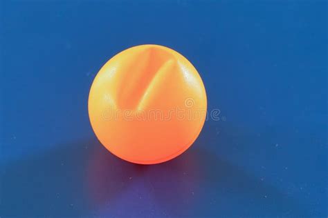 A Cracked Orange Ping Pong Ball Stock Image Image Of Game Table