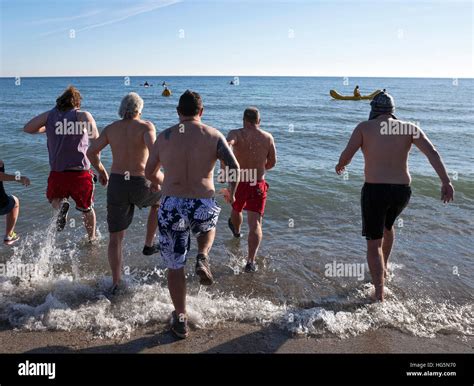 The Annual Polar Bear Plunge Into Lake Michigan Takes Place On New Year