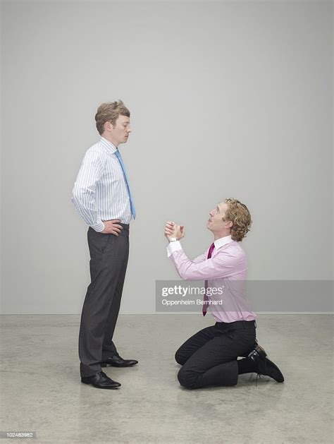 Businessman Begging On His Knees High Res Stock Photo Getty Images