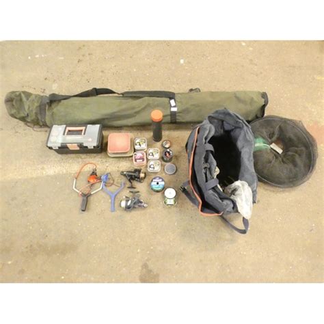 A Fishing Bag Containing Rods A Keep Net And A Quantity Of Fish Tackle