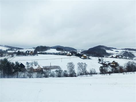 wide angle shot  small polish town covered  white snow  houses