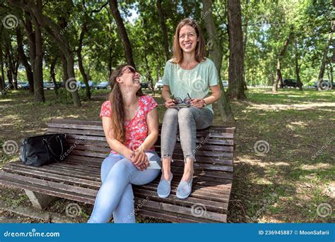 Girlfriends Sitting Together Having Fun Outdoors Concept Of Modern Women Friendship Lifestyle