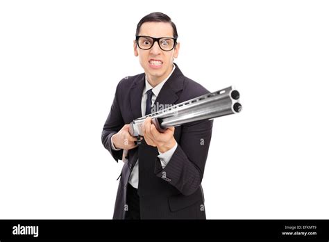 Angry Businessman Holding A Shotgun Isolated On White Background Stock